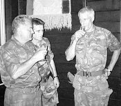 Bosnian Serb army Commander General Ratko Mladic, left, drinks a toast with Dutch UN Commander Tom Karremans, right, in Potocari, some 5 kilometers north of Srebrenica on 12 July 1995.